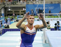 Russia's Alexei Nemov quiets the crowd after they disapproved of his score on the high bar during the men's gymnastics individual apparatus finals at the 2004 Summer Olympic Games in Athens, Monday, Aug. 23, 2004. Nemov finished fifth in the competition.